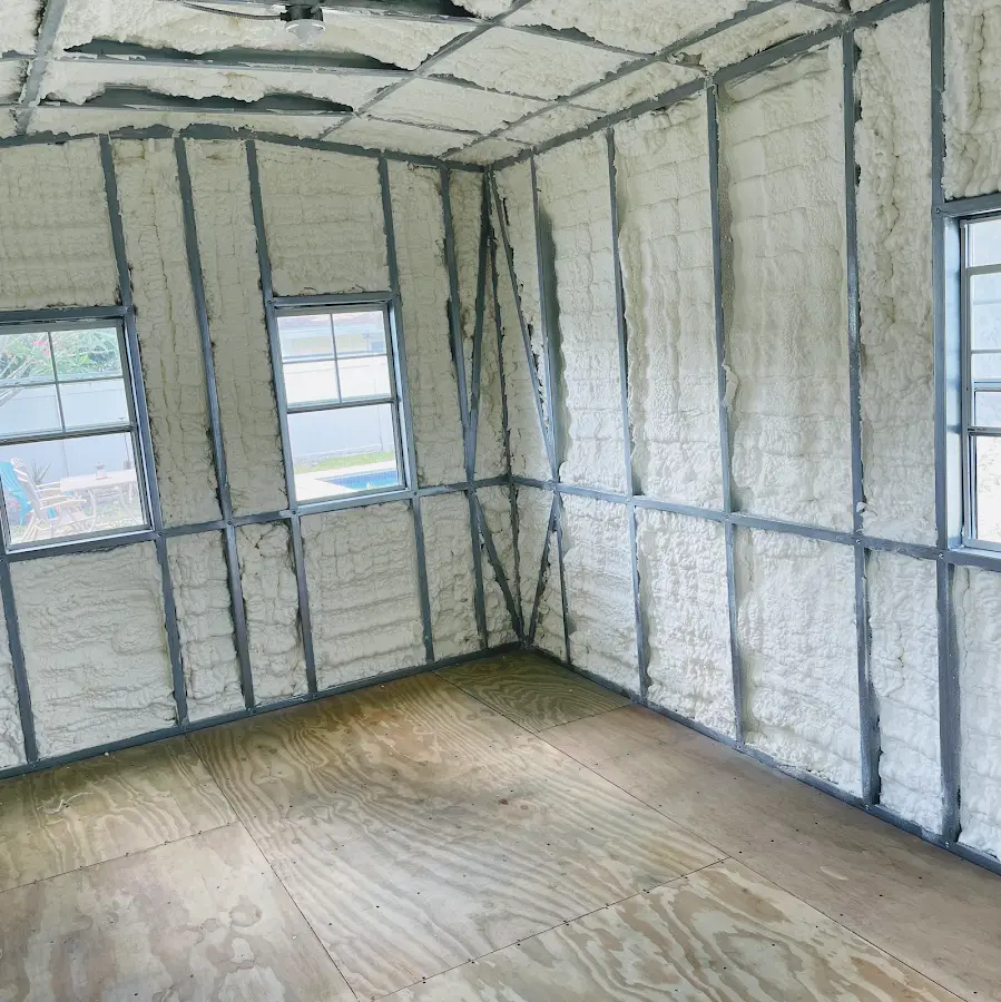 Closed-cell spray foam insulation applied to wall cavities in a residential project in Pomona